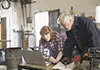 woman and man looking at laptop