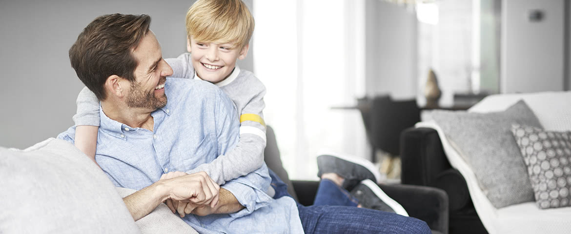 Father and son enjoy allergy-free play time in the family living room.?