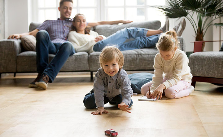 kid playing with toy on floor